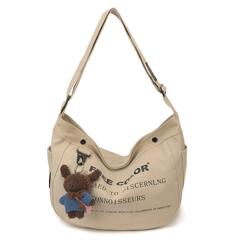 Bolsa de lona para mujeres 2026 nueva bolsa de gran capacidad transfronteriza impresa letras de viaje casual mochila de hombro