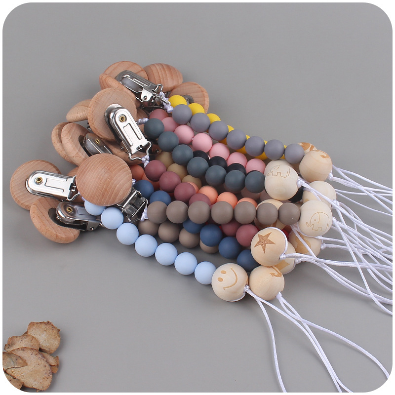 Nuevos suministros para bebés clip de chupete de haya creativo bebé DIY patrón de dibujos animados cuentas de madera Cadena de chupete cadena anti-caída
