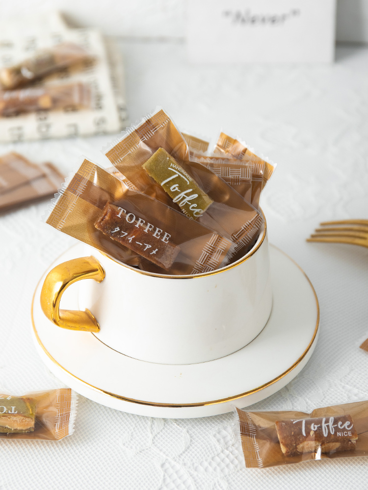 Bolsa de toffee de almendras de sal de mar gruesa independiente Tauragnut único caramelo de café sellado de máquina Año Nuevo 2025