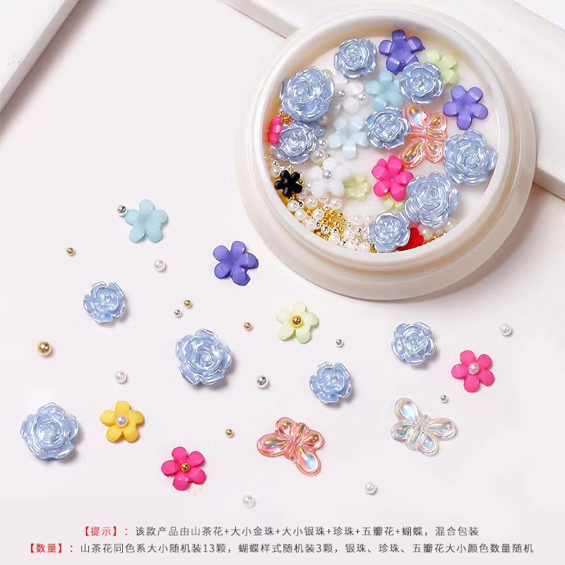 Nueva celebridad en línea suministros de uñas 3D multicolor de alto grado Camelia mariposa cinco pétalos flor bola de acero joyería de uñas diamante