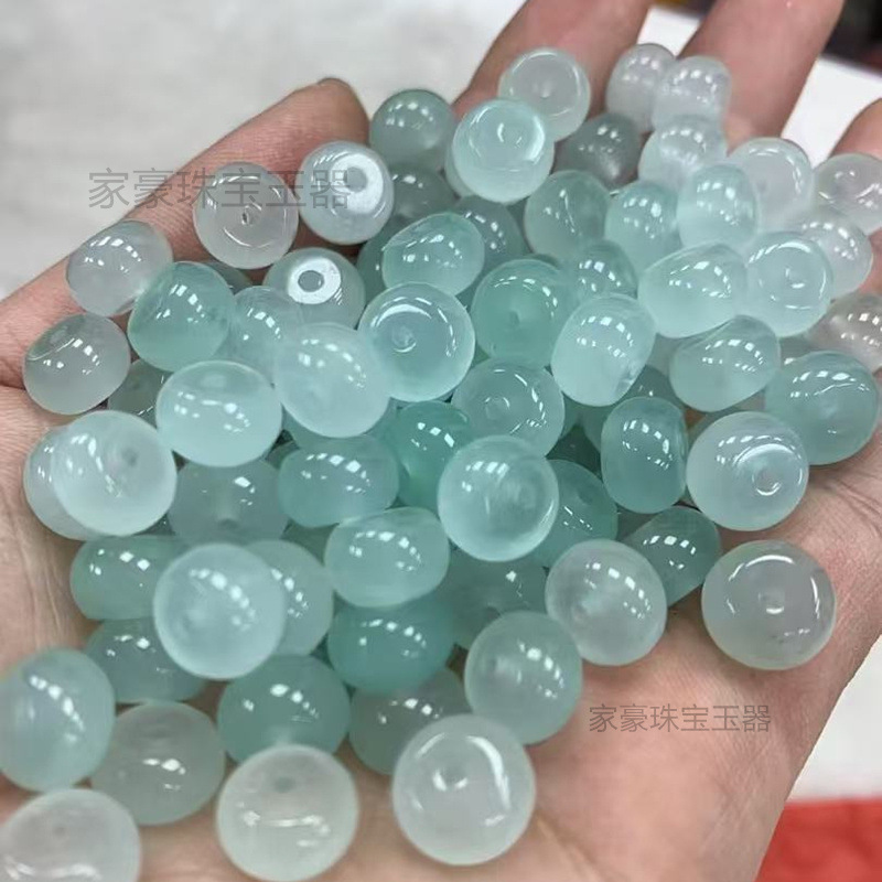 氷の底に青い花が漂っています。10mmのそろばんのビーズは卸売りします。|undefined