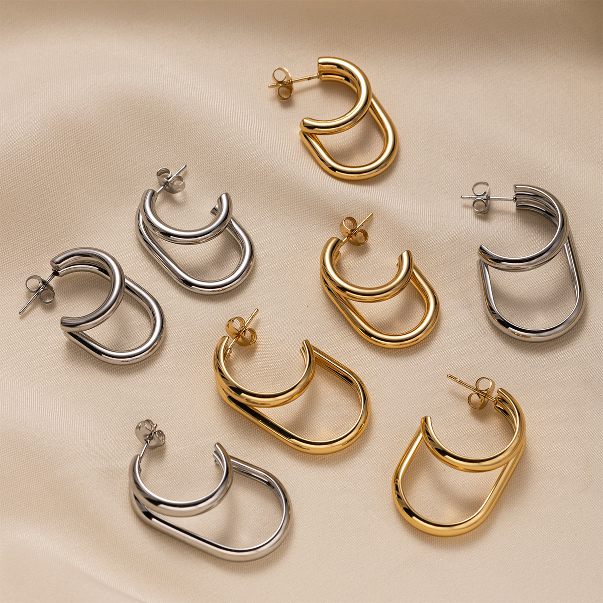 TENA europa y americana de acero inoxidable ligero de lujo de alto nivel galvanizado inductivo 18k oro de forma especial abertura pendientes de acero de titanio vacaciones