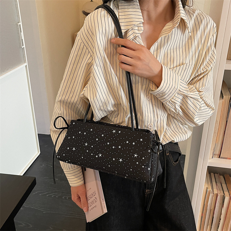 2026 primavera nuevo estilo de moda coreano lleno de estrellas de textura bolso de hombro bolso de mujer diseño de sensación diaria nicho bolso de brazo