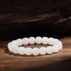 新疆の天然の和田玉の古い型の玉の手は女性の金の羊脂の白玉の桶の玉のブレスレットのリンゴの玉の正規品の玉の玉の串を結びます。