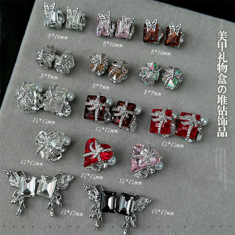 Uñas de uñas, joyas de diamantes de pila terminadas, caja de regalo de diamantes, corazón torcido de mariposa, joyas de cristal de oro, diamantes de uñas