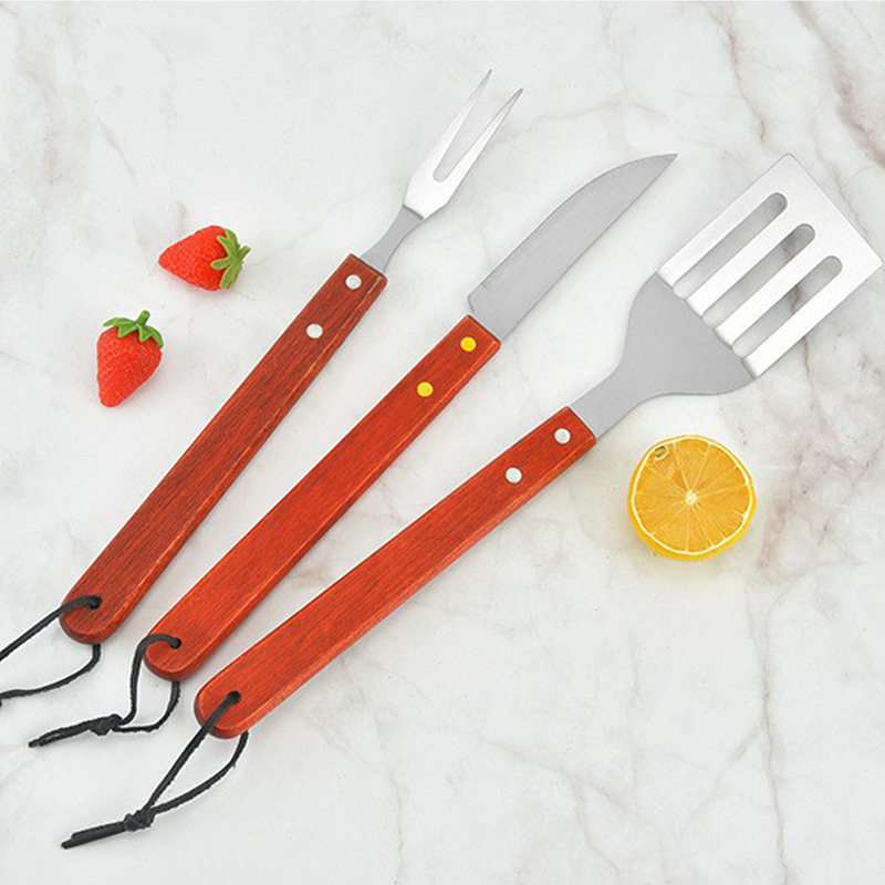 Delantal de bolsa de tela, juego de cuatro piezas, mango de madera largo rojo, cuchillo y tenedor de barbacoa, clip de comida, juego