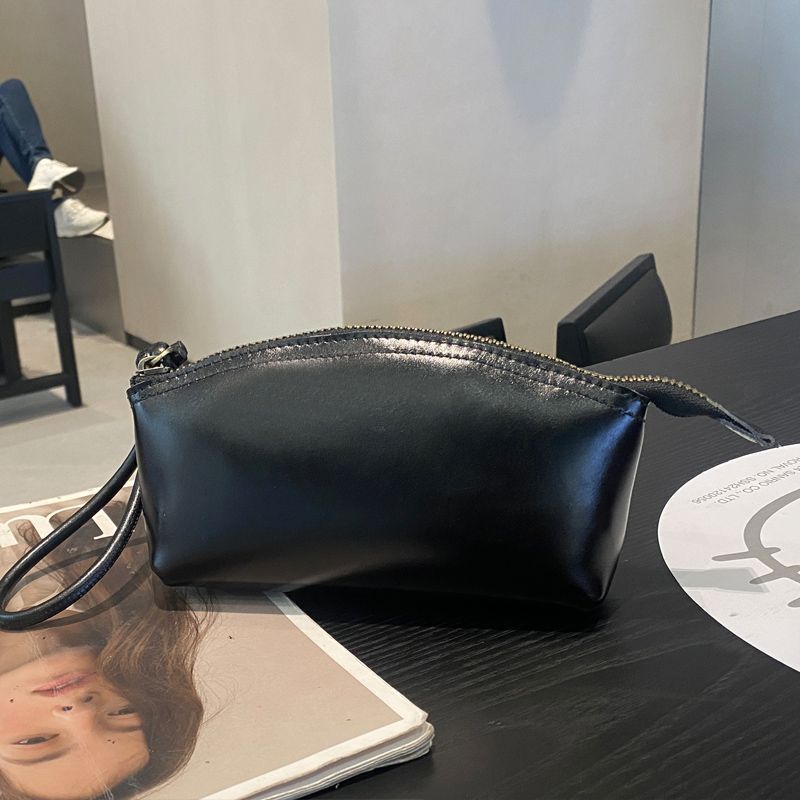 Viajes de moda primavera y verano nuevo nicho de diseño pu piel retrógrada elegante portátil bolso de bollo de gran capacidad transfronterizo para mujeres