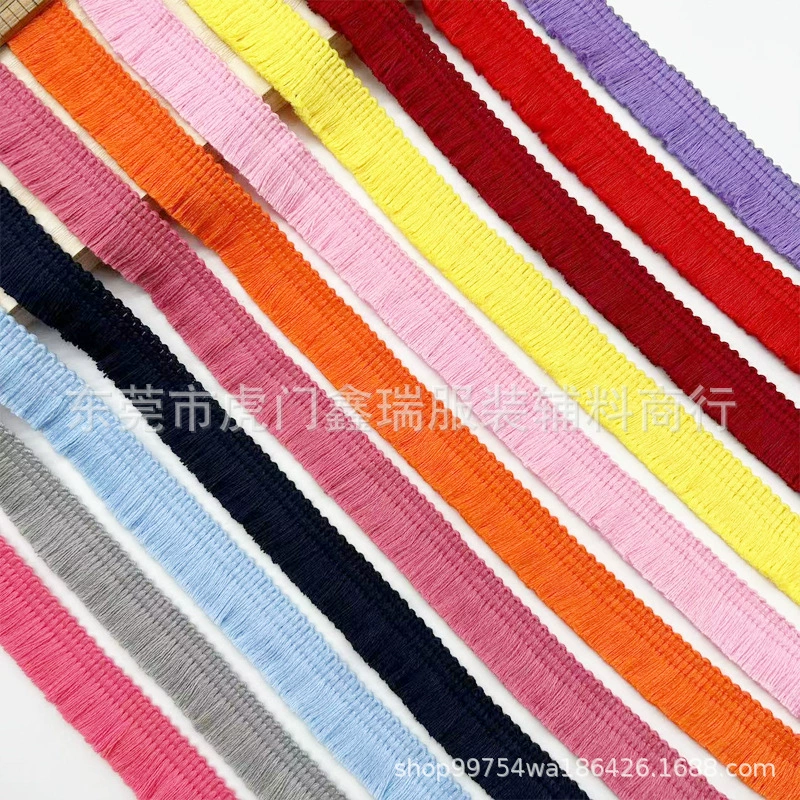 Оптовая продажа от производителя: разноцветная хлопковая односторонняя кружевная лента с бахромой и кисточками шириной 2 см для отделки одежды, юбок, подушек и декоративных элементов.