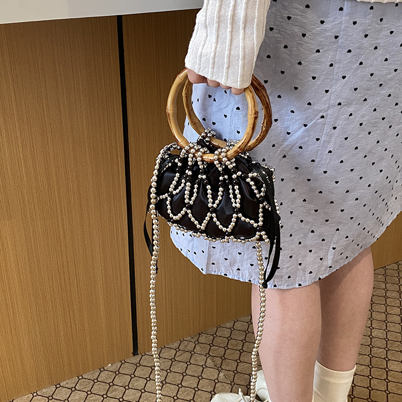 Nueva bolsa china de tejido para niños y niñas bolsas de hombro de perlas de bambú hueco bolsas de mano pequeñas bolsas de cuerda de dibujo para niños