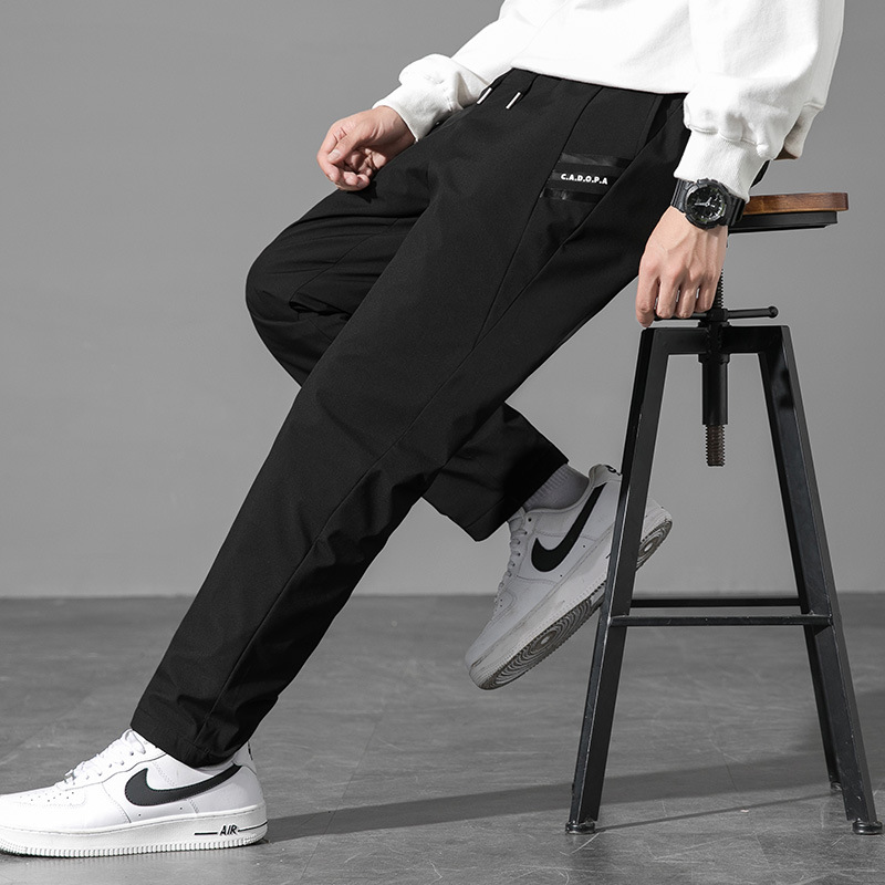 New winter down pants for men, stylish, loose fit, plus size, thickened, warm, white duck down, solid color casual pants.