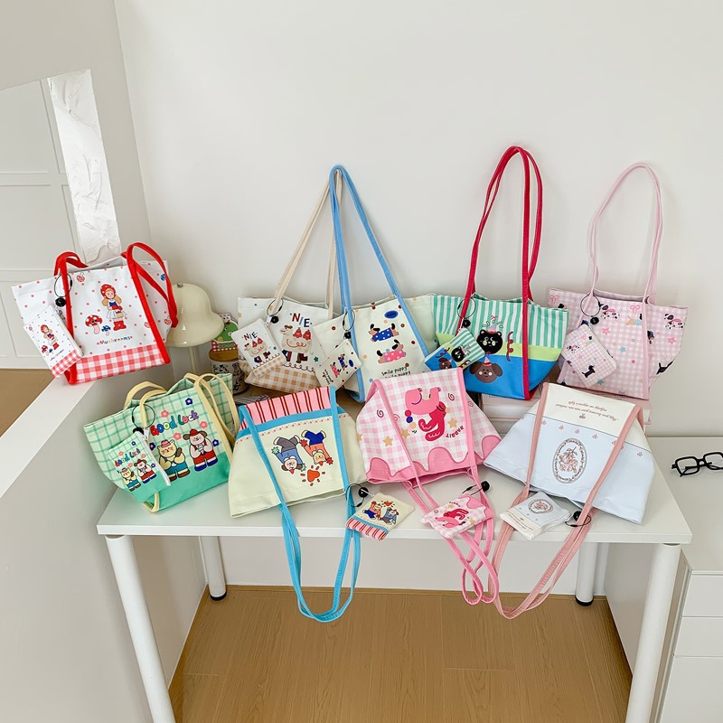 Bolsa de lona de dibujos animados japoneses 2025 nuevo bolso de gran capacidad para estudiantes de escuela primaria bolso de hombro para hombres y mujeres