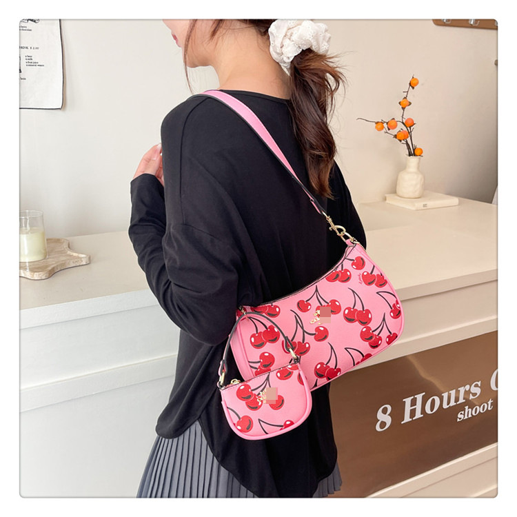 Bolsos nuevos transfronterizos para mujer 2025 moda y todo fósforo de alta gama bolso de axila de un solo hombro bolso de mensajero portátil con estampado clásico