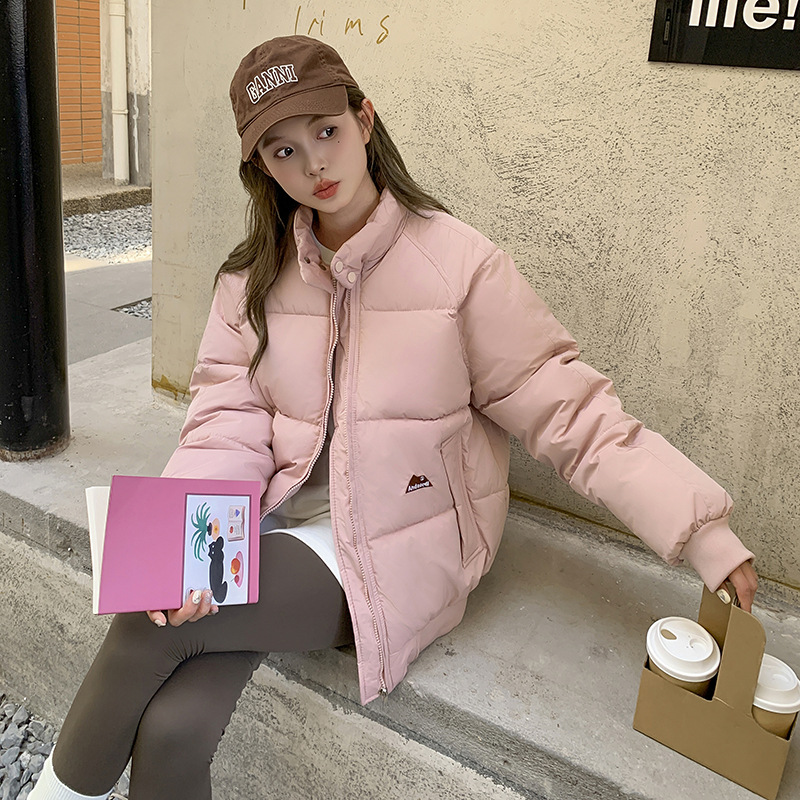 Ropa de pan para mujeres invierno 2025 nuevo color sólido versátil casal abrigo cálido suelto pareja ropa de pan de algodón
