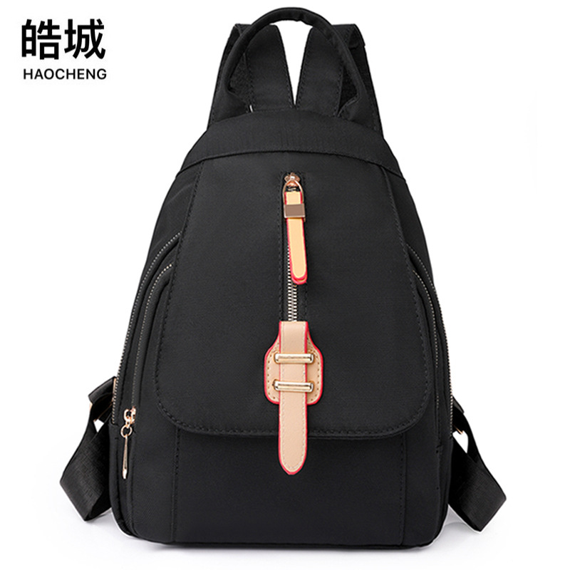 Comercio exterior al por mayor 2023 nueva mochila de nailon para mujer coreana simple mochila de viaje urbano pequeño bolso femenino