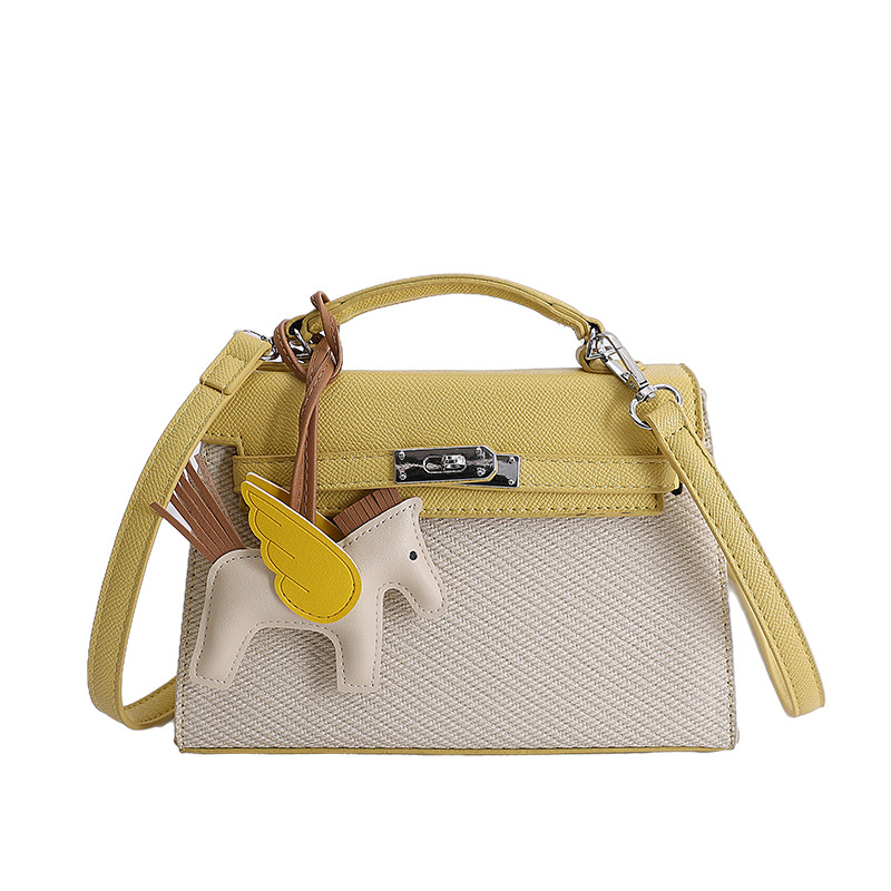 Textura de nicho bolso de diseño de mujer 2026 nuevo bolso Kylie color contraste diario simple viaje mochila de hombro