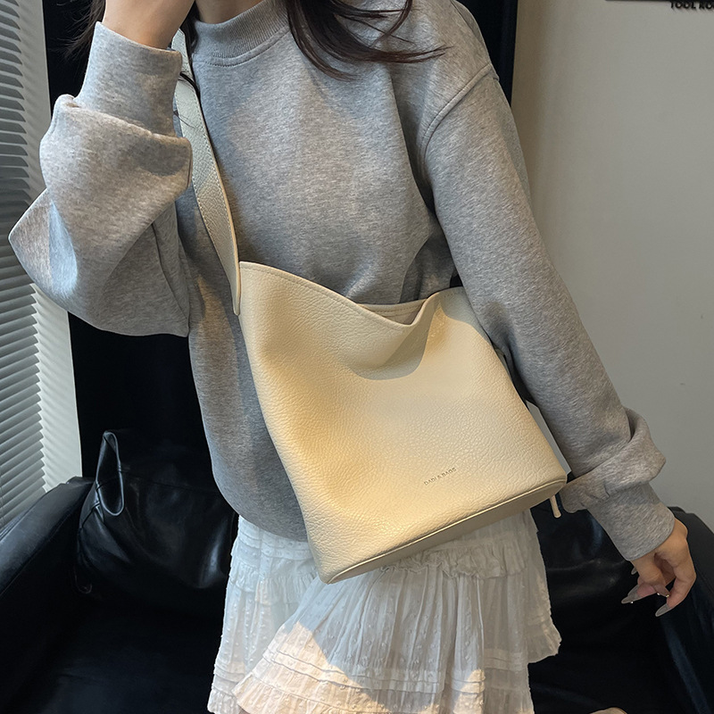 Bolso de cubo de textura transfronteriza 2025 verano nuevo bolso femenino estilo ins bolso de hombro simple