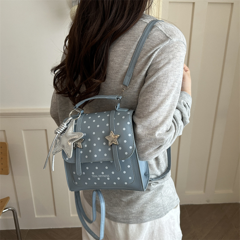 Bolsa de hombro coreana de estilo universitario de ondas 2026 nueva moda simple versátil mochila de mano de viaje