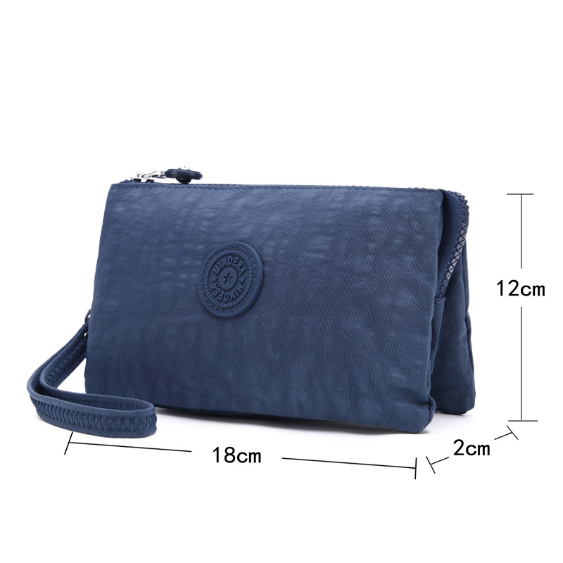 Bolsa de mano de nylon multicapa de gran capacidad a prueba de derrames de agua de mujer simple de moda larga cremallera cambio pasaporte bolso móvil