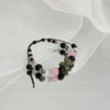 Black beaded bracelet with bow