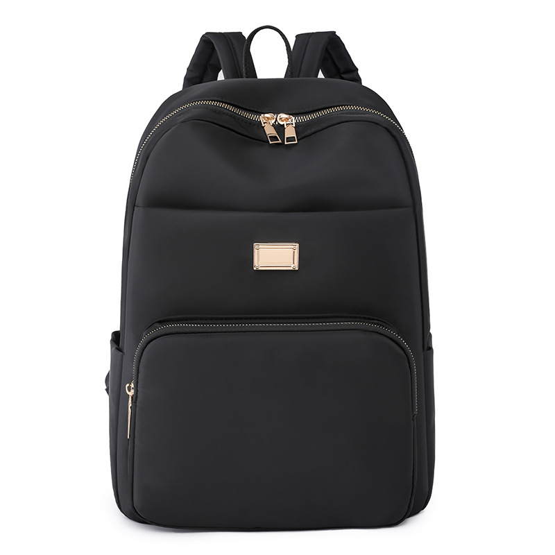 Comercio exterior al por mayor 2023 verano nuevo estilo versión coreana de las señoras mochila de nailon mochila simple de color sólido de gran capacidad para estudiantes