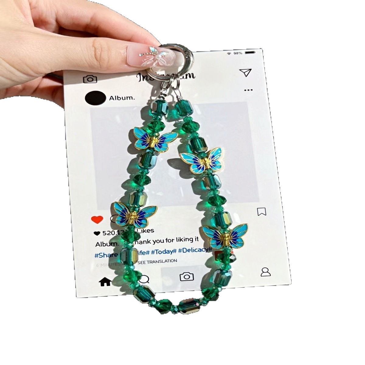 Cadena de teléfono móvil al por mayor cadena de cuentas de cristal flor de mariposa sentido de alta gama cadena corta hecha a mano para mujer bolsa de viento NIS todo fósforo