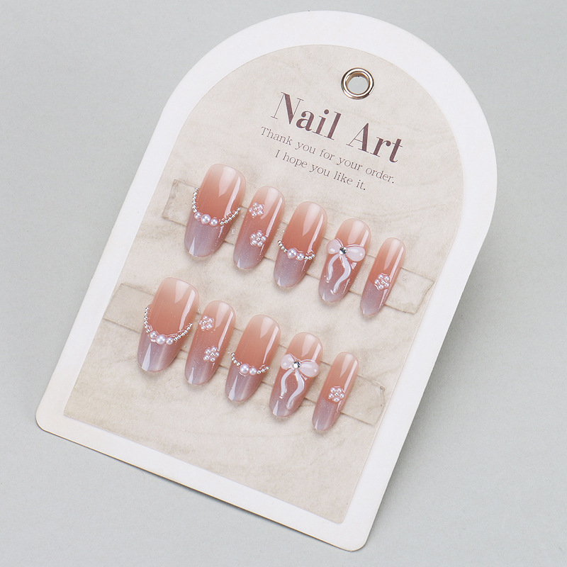 Mecha de vestir hecha a mano, piel desnuda, ojos de gato sonrientes, uñas francesas, uñas de alta calidad, uñas portátiles, productos terminados al por mayor