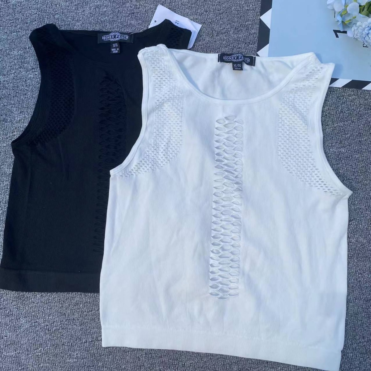 Exportación Nueva sin costuras de manga corta hueco de gran tamaño elástico cómodo prendas de vestir exteriores superior al por mayor