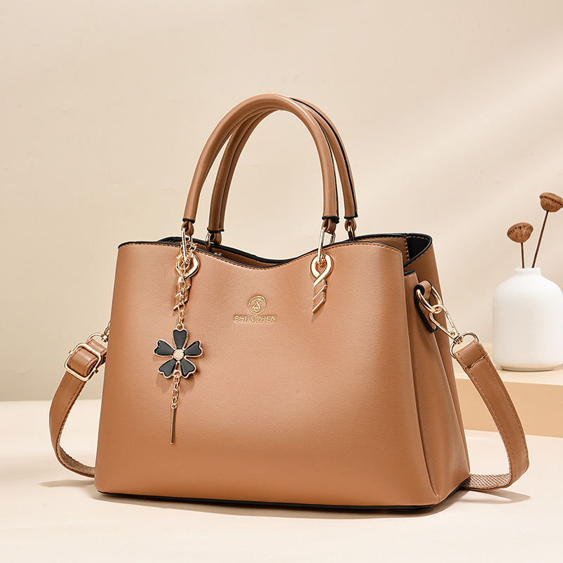Colgante de flores bolsas de mano de color sólido de gran capacidad de moda versátil bolsas de hombro ocio de viaje oblicuo bolsas transfronterizas