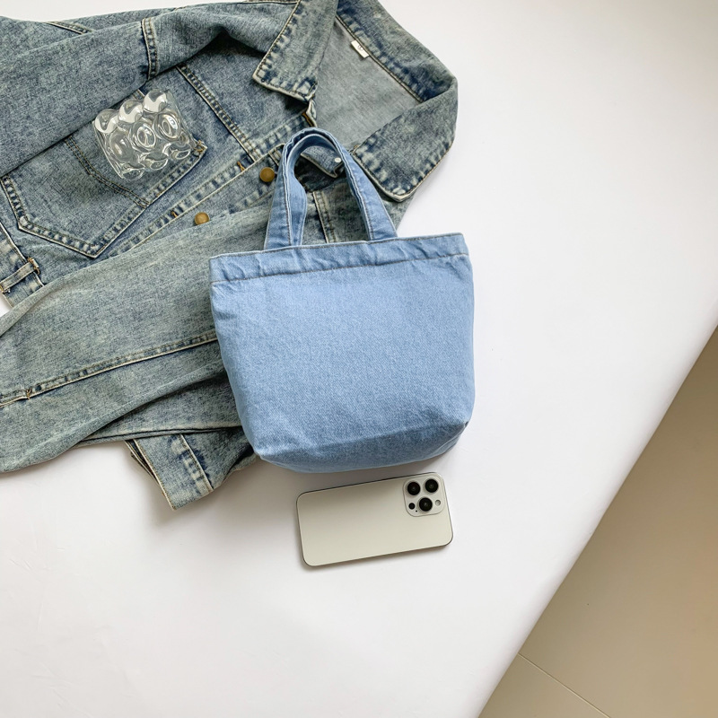 Regalos al por mayor de bolsos vaqueros, tendencias de moda simples, bolsos literarios y artísticos de gran capacidad, versión coreana de bolsos de lona de desplazamiento de estilo extranjero