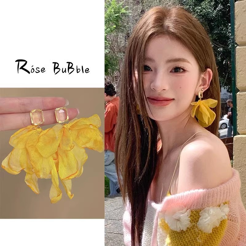 Yellow exaggerated earrings