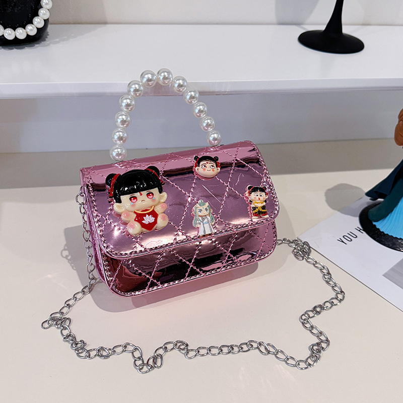 2025 nuevo niño pequeño viento mochila de hombro pequeña niña espejo princesa bolso de perla bolso de dibujos animados