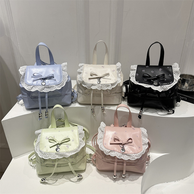 Mochila de flores para mujeres 2026 nueva moda alta sensación de mochila de estilo universitario ultra caliente de moda versátil mochila de viaje