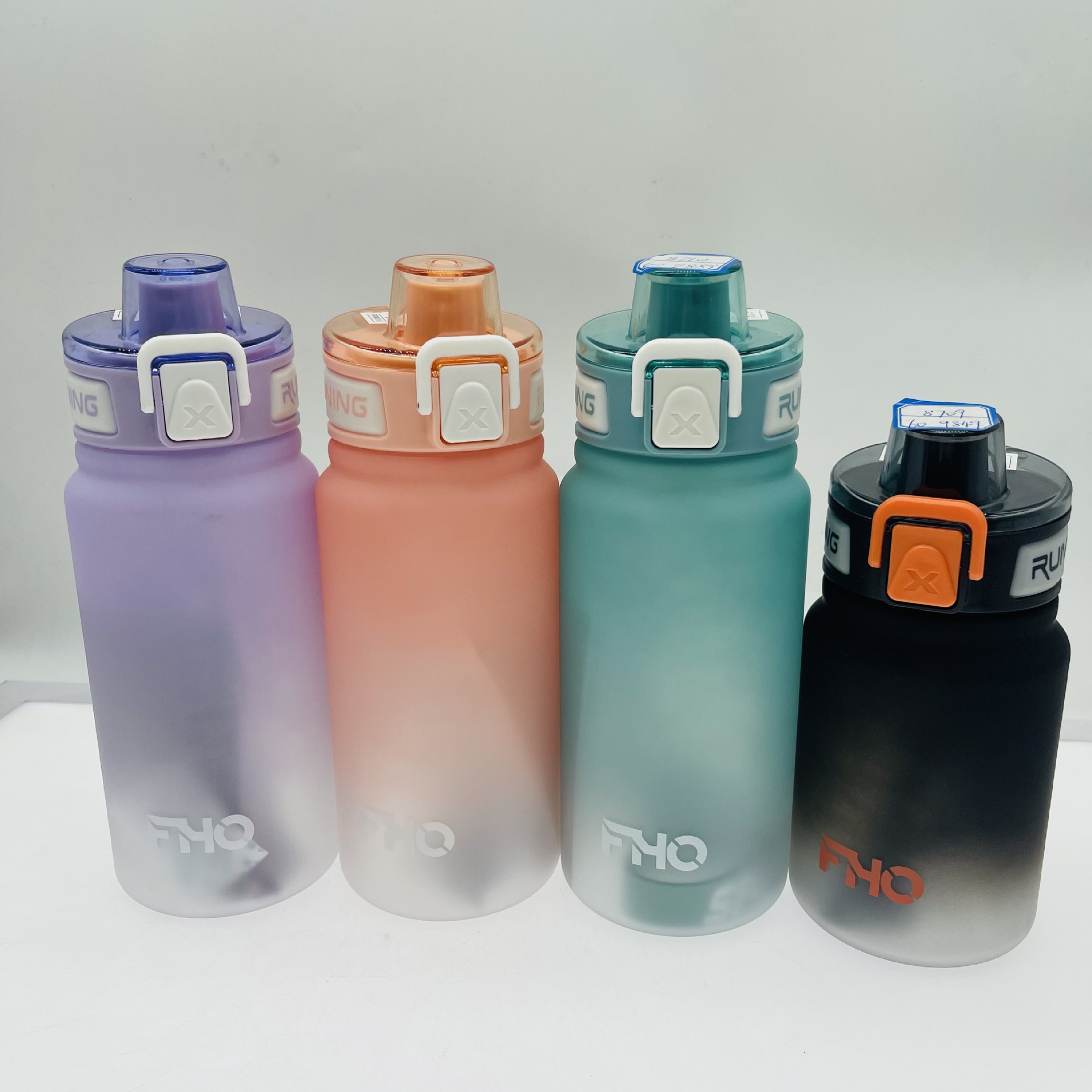 Yichang 8711 Comercio exterior gradiente plástico taza de agua 950ml gran capacidad deportes al aire libre mango espacio al por mayor