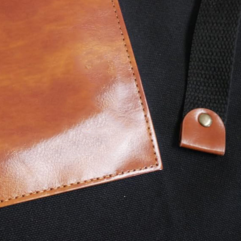 Amazon delantal transfronterizo de moda empalme pu corte de pelo ajustable cuello colgante lienzo grueso delantal de trabajo logo personalizado