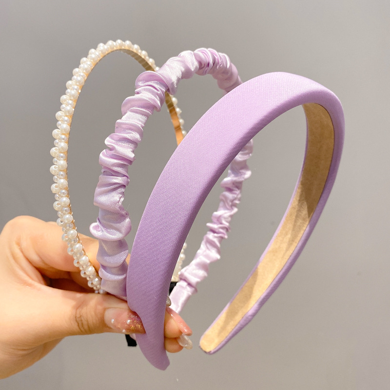 A principios de la primavera, la banda de cabello para mujeres en línea, 2025 nuevo lavado de cara de presión de tarjeta de cabello para el cabello, banda de cabello de perlas, banda de cabello para mujeres.