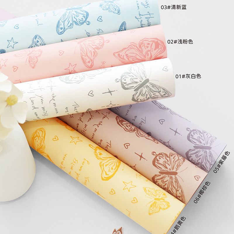 Fabricante de fiestas de flores al por mayor nuevo producto estampado de mariposas papel de embalaje de flores floristería transfronteriza paquete de ramo paquete de papel papel de flores