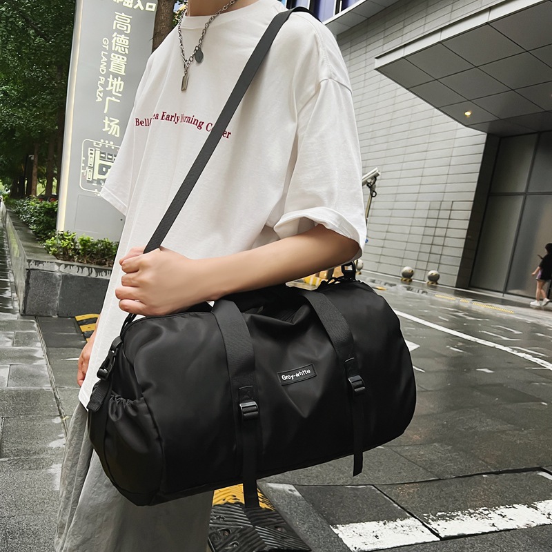 Nueva bolsa de equipaje simple negra de gran capacidad portátil bolsa de viaje corto 2024 bolsa deportiva de ocio para hombres