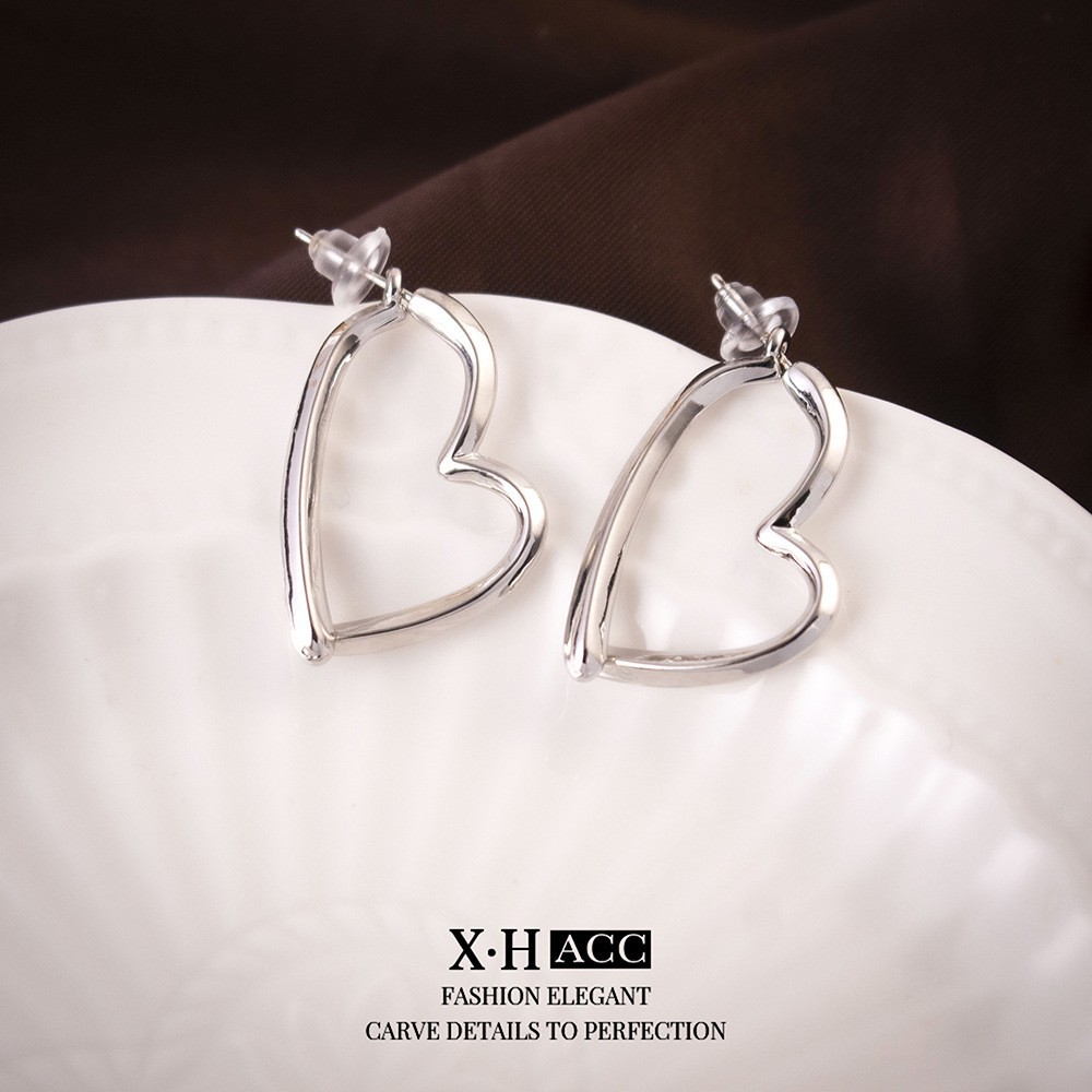 Aguja de plata de moda alta sensación de diamante de goteo de aceite pendientes nicho universal elegante pernos de orejas ligero lujoso temperamento simple orejas para mujeres