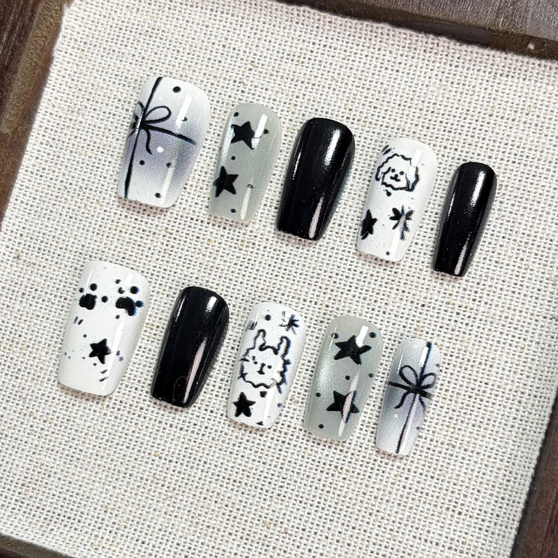 【Jiaolong】Black and white hand-painted cartoon nail art featuring cute and cool designs of puppies, rabbits, stars, and bows, creating a stylish and atmospheric look