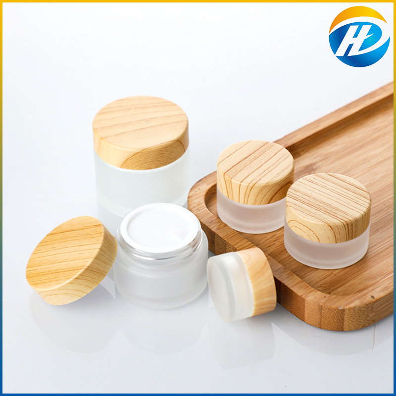 Venta al por mayor de madera grano cubierta botella de crema facial botella de crema botella cosmética de vidrio esmerilado 30g 50g crema sub-botella