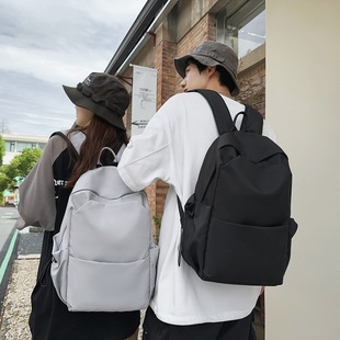 2023 new large-capacity solid color backpack women's Korean-style all-match schoolbag men's high school backpack College student travel fashion