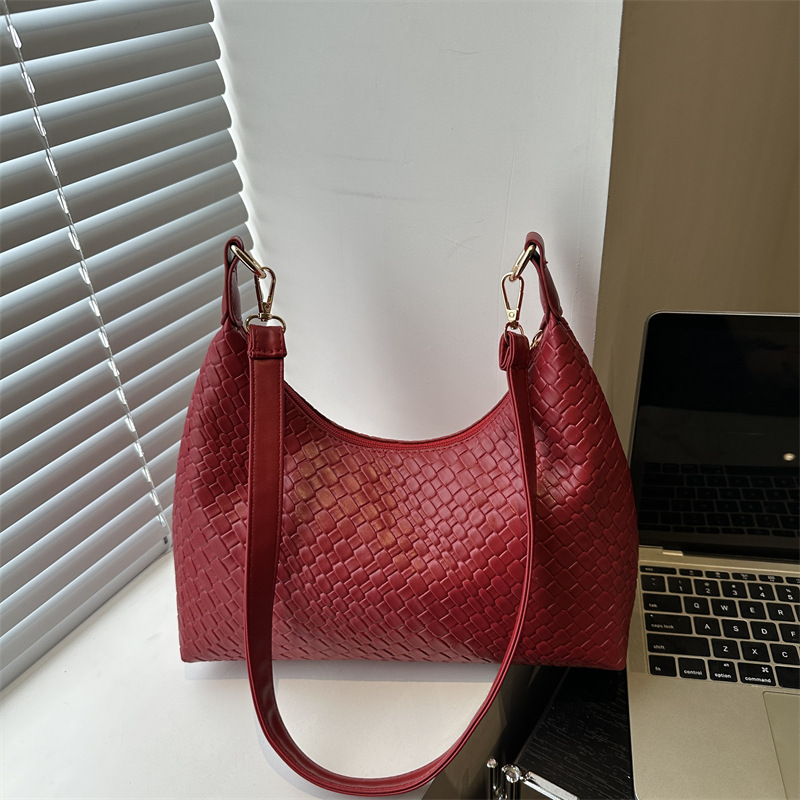 Moda popular tejido de cercanías 2025 nueva gran capacidad diseño casual simple axila bolso portátil