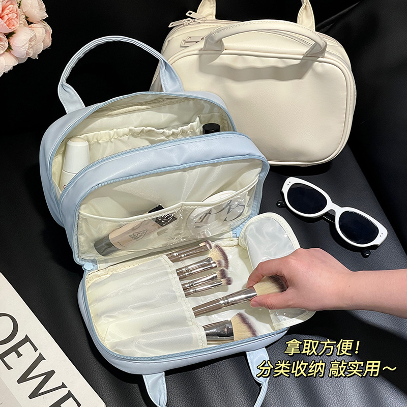 2024 nueva bolsa de maquillaje portátil PU de viaje portátil bolsa de almacenamiento de doble capa de gran capacidad bolsa de alta calidad