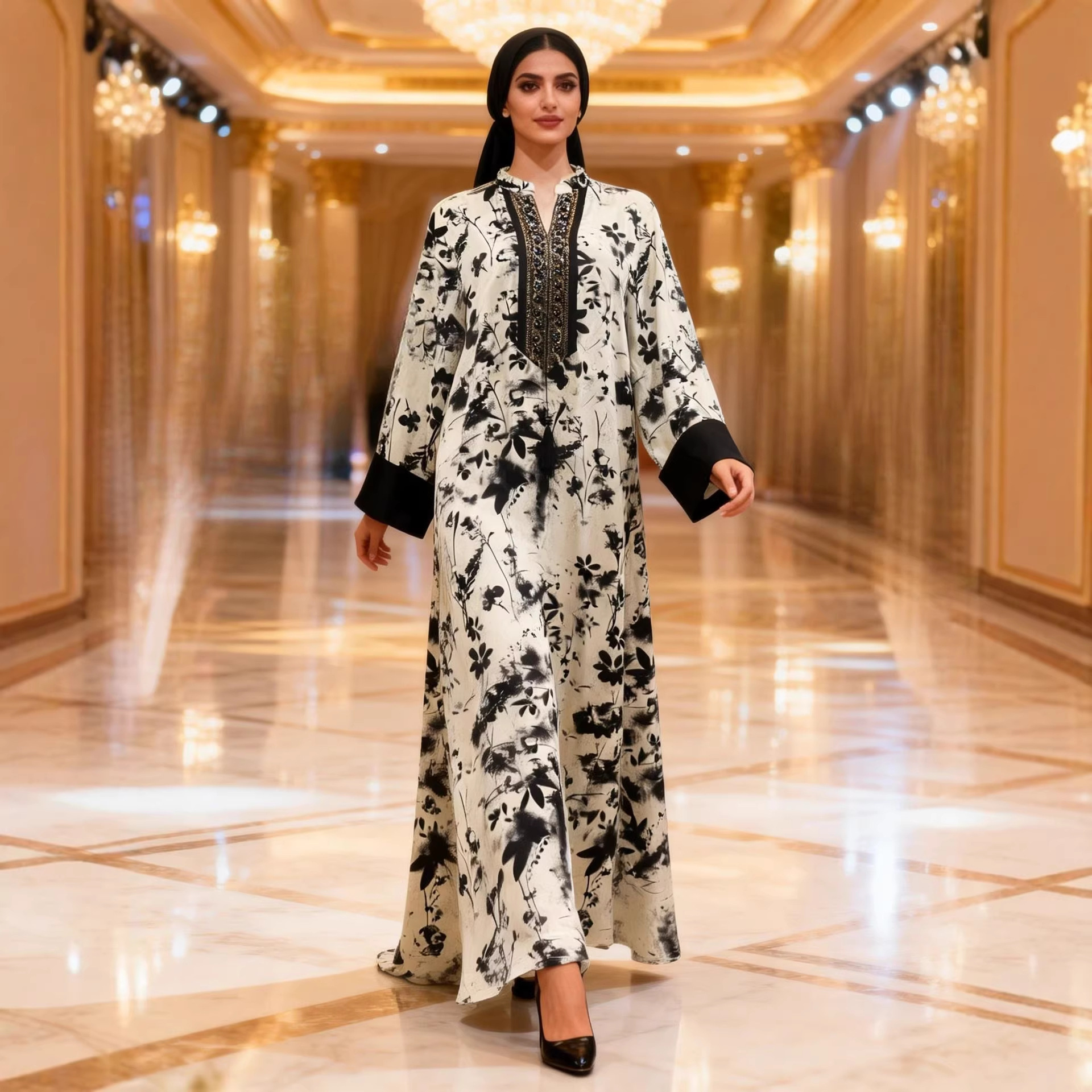 In stock, fast shipping. Women's ethnic style long-sleeved black and white ink print maxi dress with beaded neckline.