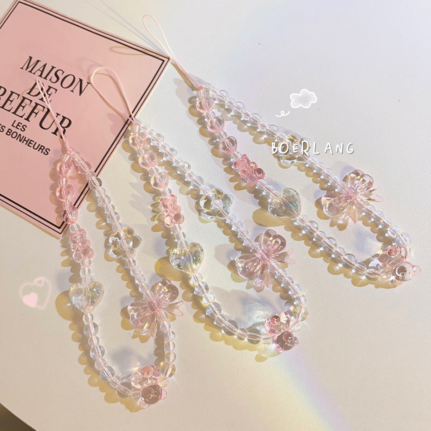 This cute pink beaded bracelet/charm is suitable for all phone cases and has a universal design.