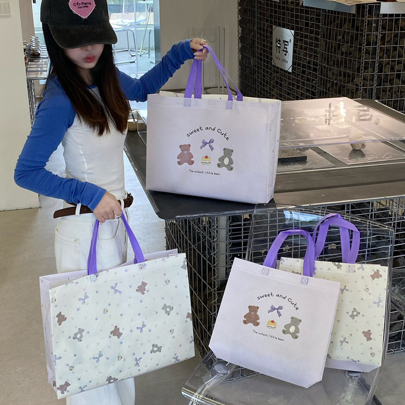 Korean-style gentle non-woven fabric tote bag, ins-style women's clothing store packaging, waterproof and eco-friendly custom gift shopping bag Korean-style gentle non-woven fabric tote bag, ins-style women's clothing store packaging, waterproof and eco-friendly custom gift shopping bag