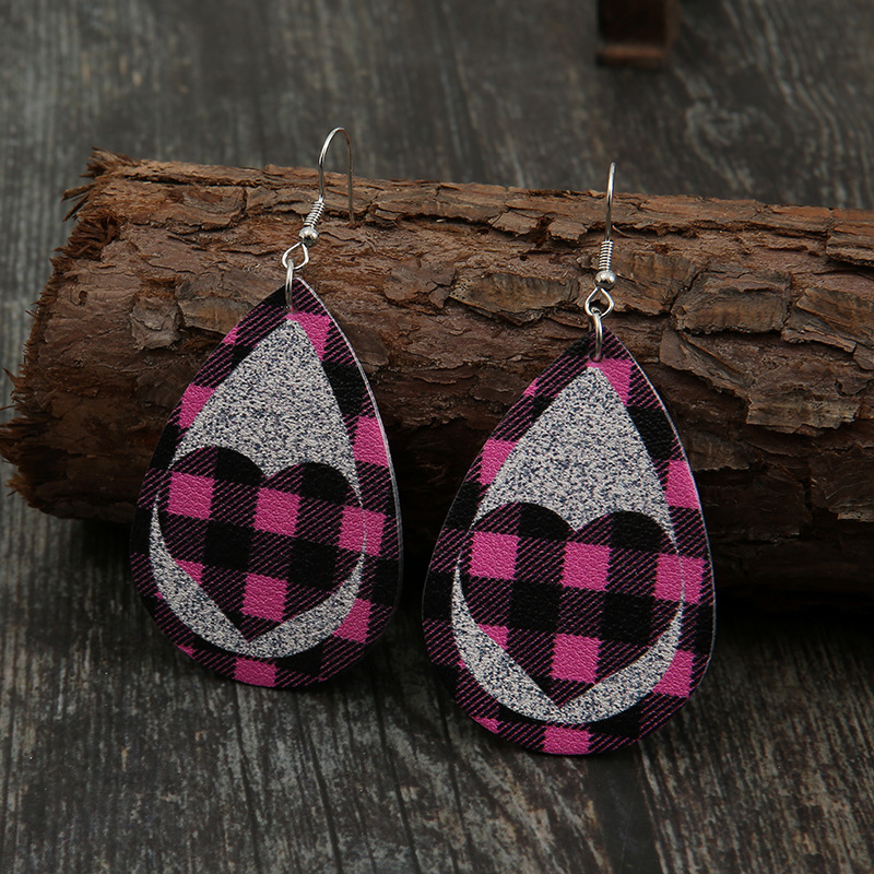 New Pink Black Grid Silver Sequined Leather Earrings Peach Heart Hollow Earrings Wholesale display picture 1