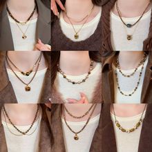 秋冬复古咖色圆形虎眼石项链法式温柔气质毛衣链轻奢高级感项饰女