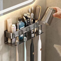 銃の灰色の歯ブラシの置物棚のトイレの穴を開けないでうがいコップの歯のコップの壁掛け式の収納棚の電動の歯ブラシの棚