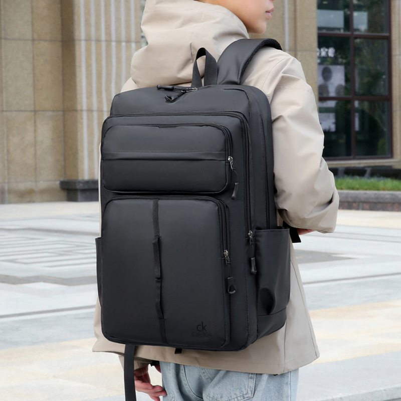 Mochila nueva tendencia de la moda bolsa de computadora de negocios de ocio de gran capacidad color sólido luz impermeable mochila transfronteriza